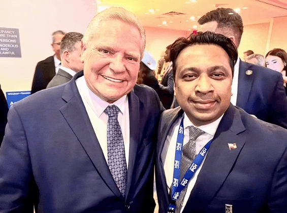 Murshed Nizam standing with Doug Ford at an Ontario PC event